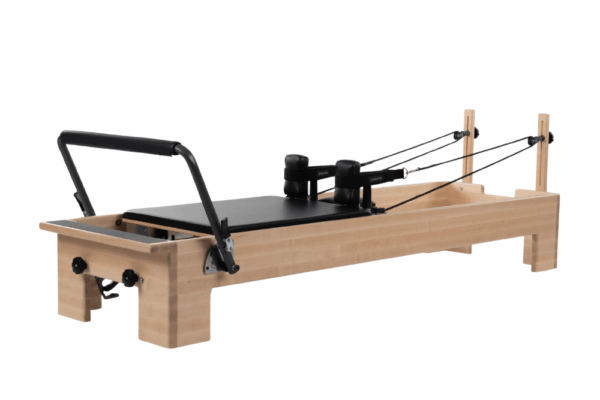 Balanced Body Studio Reformer with maple wood frame and footbar