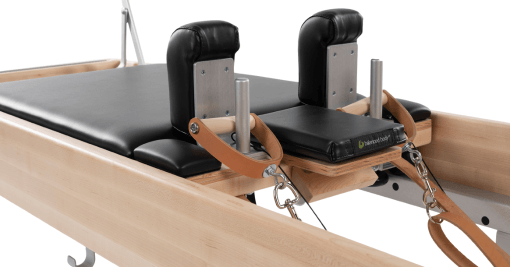 Balanced Body carriage with smooth ride, black upholstery, and shoulder rests.