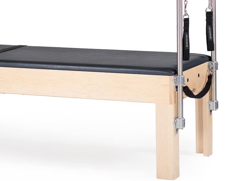 Balanced Body Cadillac table frame made of hard maple with durable vinyl upholstery.