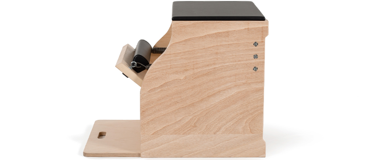 Pilates chair with blockboard frame and black upholstered seat