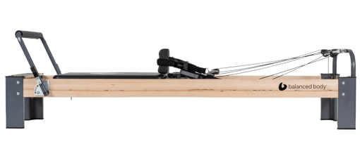 Pilates reformer with adjustable straps for dynamic exercises