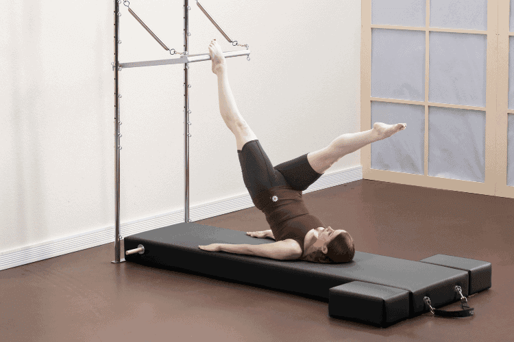 Pilates workout with Raised Mat and Moon Boxes in studio setting.