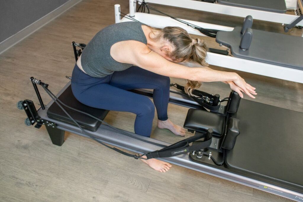 Person using Allegro Add-a-Platform on Pilates Reformer.