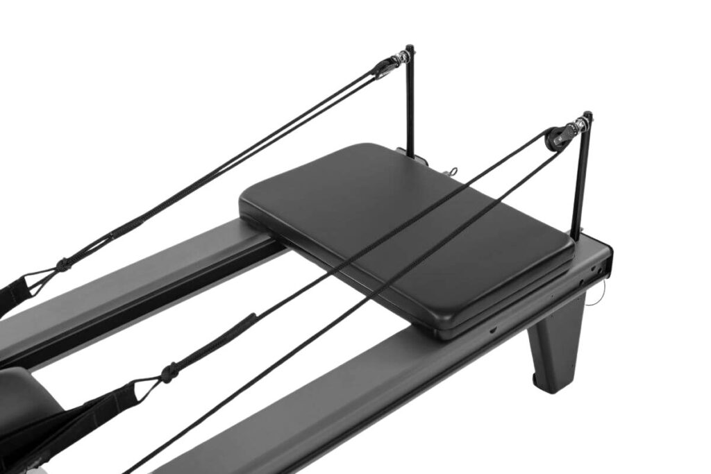 Allegro Add-a-Platform accessory on Pilates Reformer.