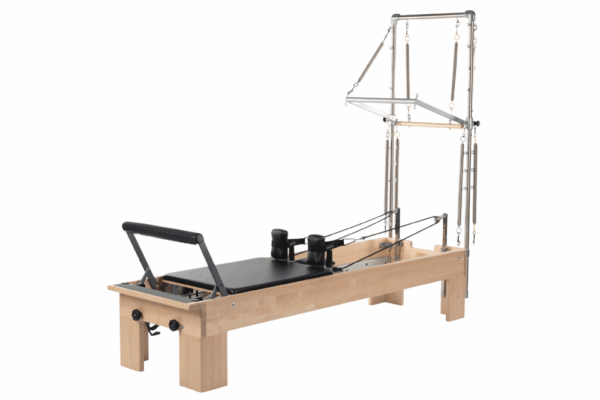 Studio Reformer with Tower Pilates equipment for versatile training.