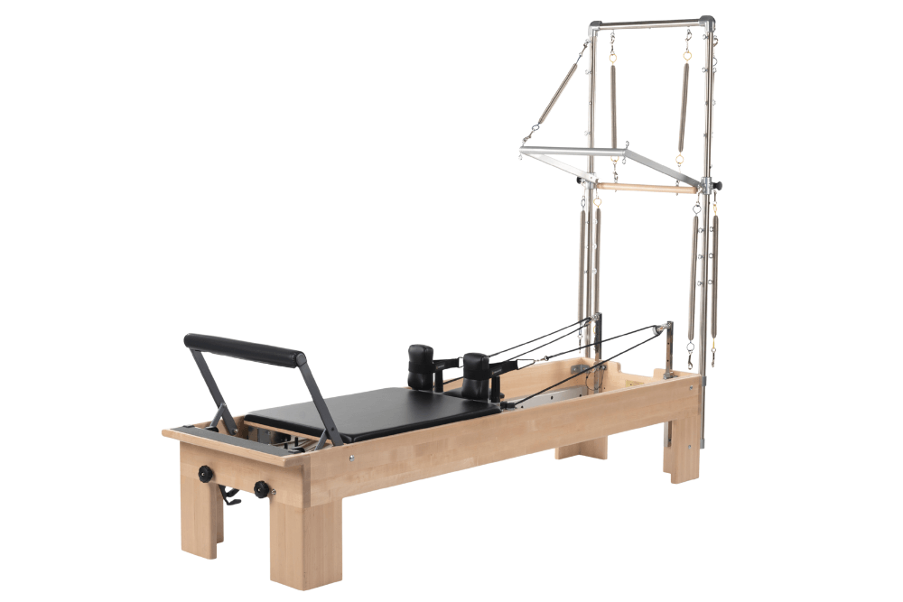 Studio Reformer with Tower Pilates equipment for versatile training.