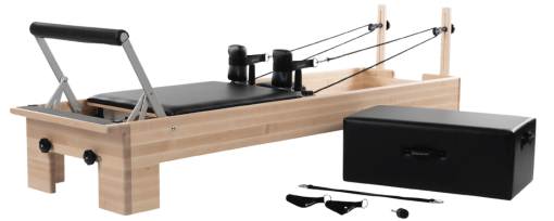 Pilates reformer with Sitting Box, cotton loops, neoprene handles, and foot strap.
